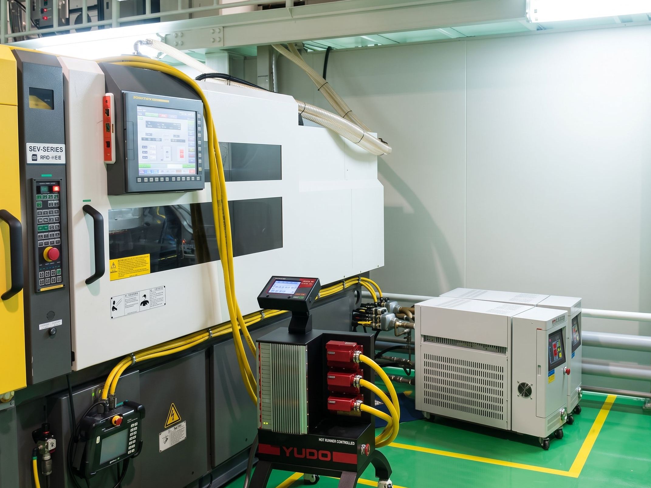 Two sets of the MTCs set up next to the injection molding machine.